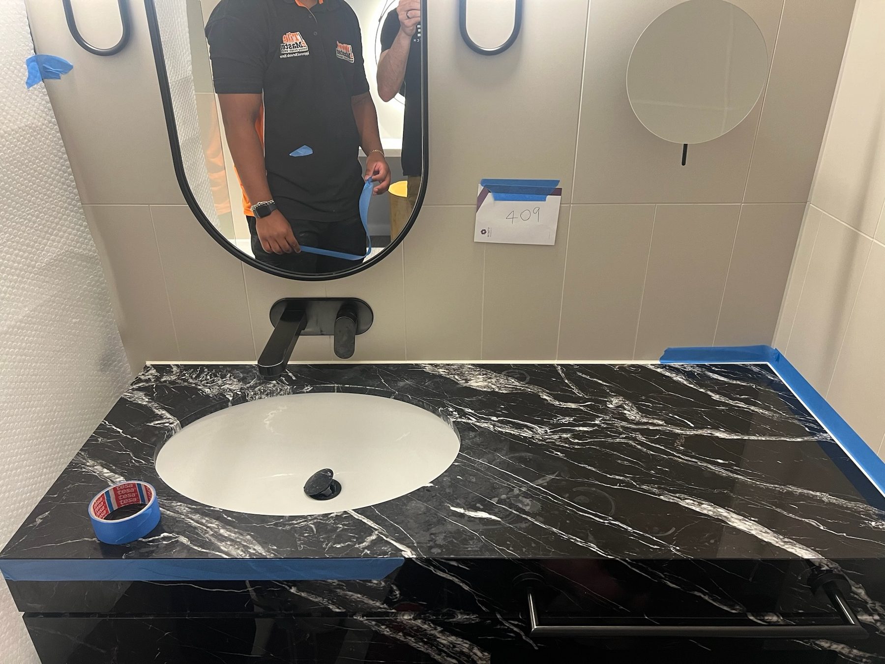 Marble vanity at Hyatt Stratford taped and protected